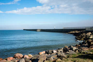 Fototapeta na wymiar Lighthouses at piers in Aberdeen Harbour entrance