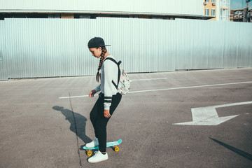 Pre teen skater on the city street © Alena Ozerova