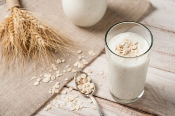 Fresh dairy products and wheat on rustic wooden background. Organic farming dairy concept