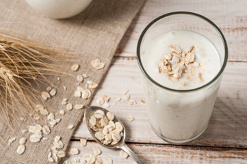 Fresh dairy products and wheat on rustic wooden background. Organic farming dairy concept