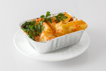 Potato gratin on the foil case box dish
