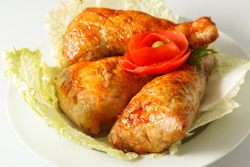 chicken fried legs with vegetables on the plate