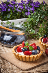Fresh homemade fruit tart with strawberries and blueberries.