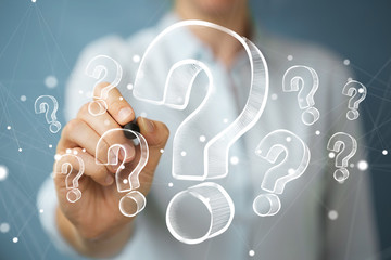 Businesswoman drawing hand drawn question marks