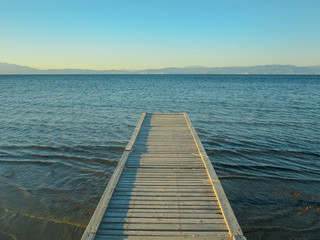 Fototapeta premium Path to the sea. Wooden bridge to the sea, island of Thassos, Greece