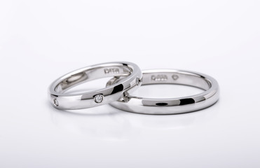 Matching Wedding and Engagement white gold Rings on white background