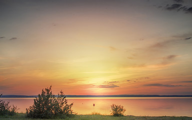 Fototapeta na wymiar sunset on lake beach