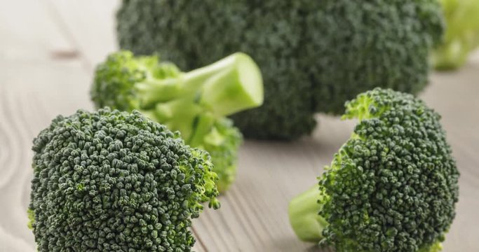 fresh broccoli on wood board