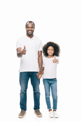 father and daughter showing thumbs up