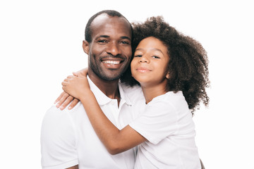 african american father and daughter hugging