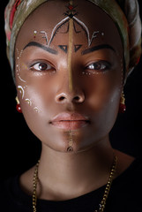 Model in African style with expressive make-up and in bright clothes