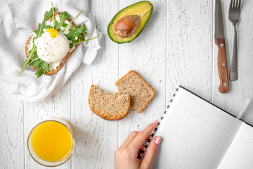 sandwich with poached eggs on wooden background top view mockup
