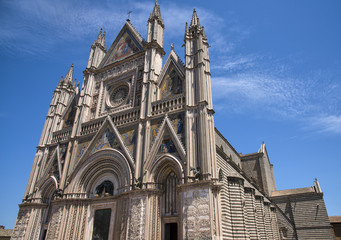Fototapeta na wymiar ORVIETO, ITALY - JULY 2017- Orvieto Cathedral (Duomo di Orvieto, Cattedrale di Santa Maria Assunta). Sunny day.