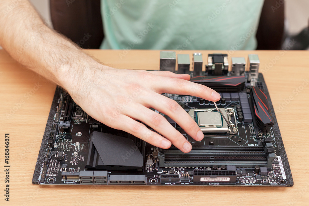 Poster plug in cpu microprocessor to motherboard socket