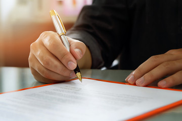 Close up of business man signing contract making a deal, business contract details. Businessman...