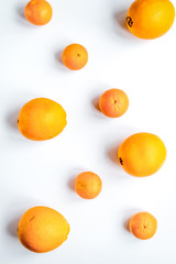 fresh orange fruit on white background top view pattern