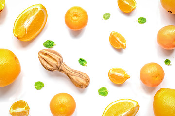 Cut oranges for juicy breakfast on white background top view pat