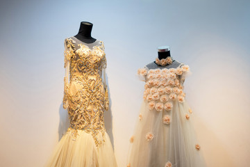 Set of wedding dress gown mom and kids daughter on mannequin in bridal gown. Bride's morning wedding preparation concept