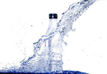 Obraz na płótnie Canvas Water splash drop to bottle refreshing product with splashing aqua elements on white background . Close up of splash of water forming explode shape