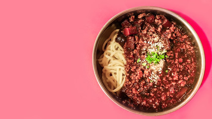 Black Bean Sauce Noodle ( jajangmyeon ) Popular menu Noodle in Korea food style . on pastel colors table .for copy space for text or Use of photo card background and Insert into message.