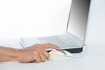 Man hand clicking on mouse of laptop .Life is never easy like this before,Modern lifestyle concept,internet banking concept,isolated white background.