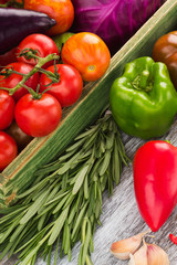 Set of raw vegetables in the wooden tray