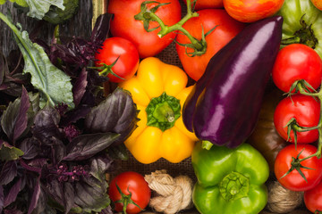 Set of raw vegetables in the wooden tray