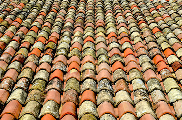 old roofing tiles in different colors close up