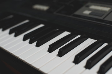 Keyboard synthesizer close-up, piano keys