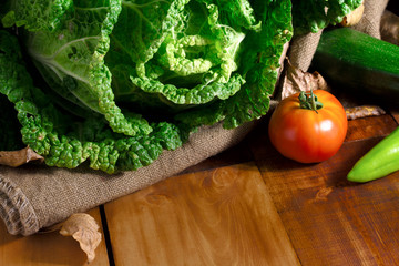 Vegetables on wood. Bio Healthy food, cabbage, tomato. Organic vegetables on wood