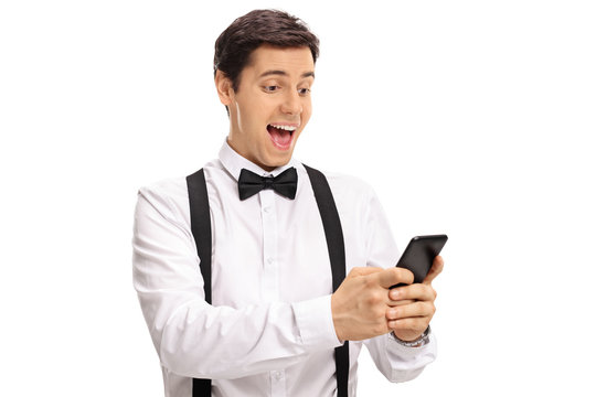 Happy groom using a phone