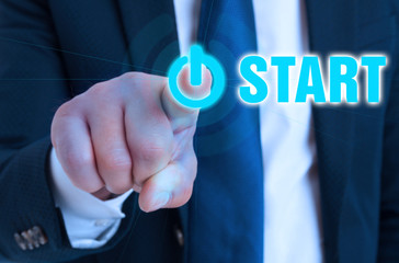 Closeup hand of entrepreneur pointing on start button