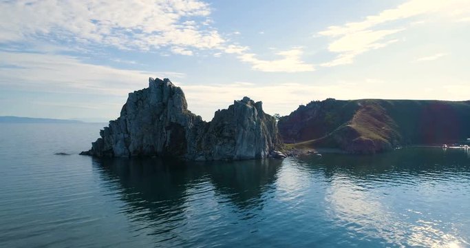 View of the Baikal Bay Shamanka in summer day. Olkhon. Drone footage.A famous tourist site. Symbol of lake Baikal. Cape Burhan