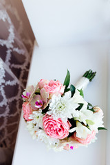 Wedding bouquet on the window sill