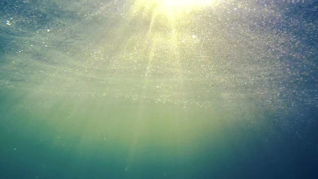 The sun's rays pervade the water