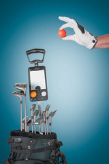 Professional golf equipment in studio on green & blue background