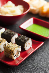 Sushi food on red plate and wasabi