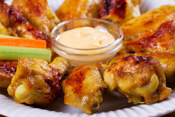 Chicken wings buffalo. Chicken with celery and carrot sticks