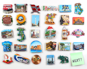 Many magnets on the refrigerator from the countries of the world - where to go? - obrazy, fototapety, plakaty