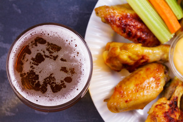 Beer and chicken wings buffalo. Ale. Beer and food concept. View from above, top studio shot