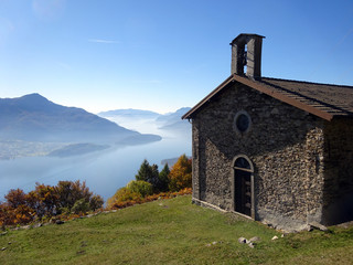 Fototapeta na wymiar View on Lake Como from Montemezzo with little church in front