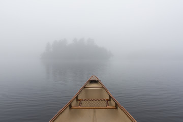 Fototapeta na wymiar Canoe bow on a misty lake - Ontario, Canada