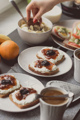 Breakfast with dark bread, white cheese , jam and coffee.  