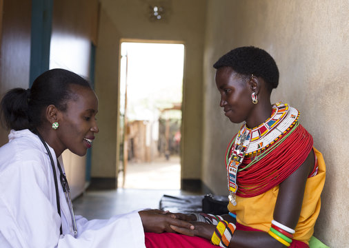 Female Doctor examining woman from Samburu tribe. Kenya, Africa.