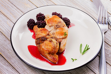 Rabbit in blackberry sauce with thyme and rosemary