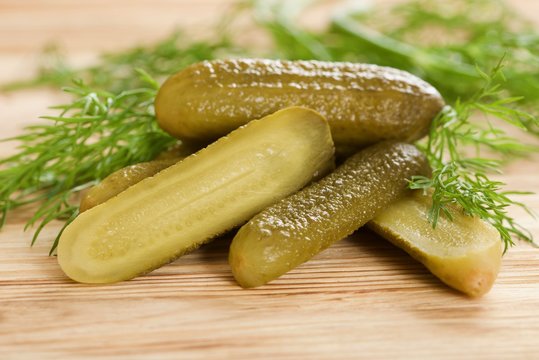 pickled cucumber on a wooden background