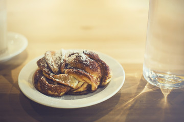 Croissants bakery for morning breakfast meal with coffee and water