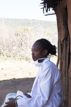 Female Doctor working in Maasai village. Kenya, Africa