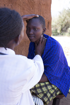 Female Doctor examining female patient. Kenya, Africa