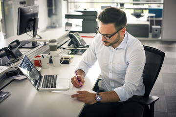 Business man writing  document. Business man in office.